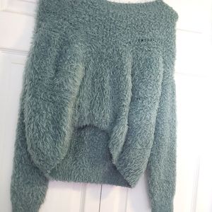 Blue-green, fuzzy sweater